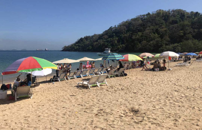 Tourists enjoying the beach in Taboga, summer 2020