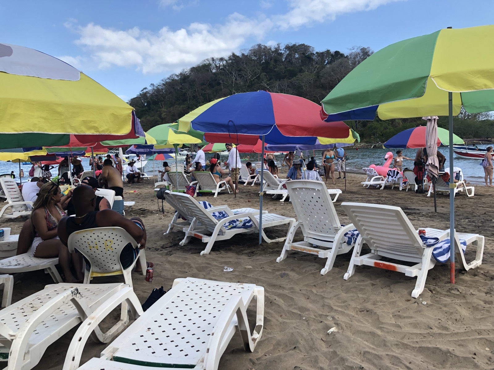 Archive photo of a Taboga beach in summer season, full of umbrellas and beachgoers (not specifically from the Euphoria festival or the 2016 Crossing Panama-Taboga).